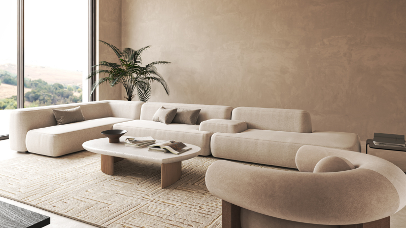 Top-down 3D floor plan of a studio apartment showing a Grainv modular sofa used as a room divider between the living area and sleeping zone to maximize square footage.