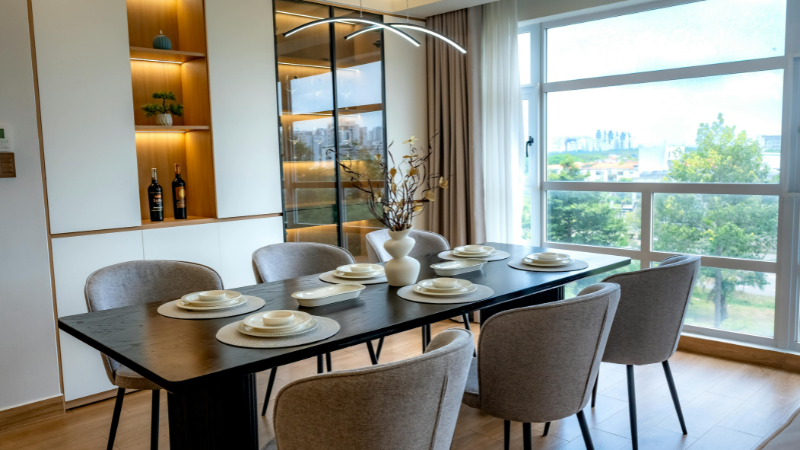 Minimalist living room interior featuring space-saving nesting tables and a modular ottoman from Grainv to create an adaptable social flow in a small apartment.